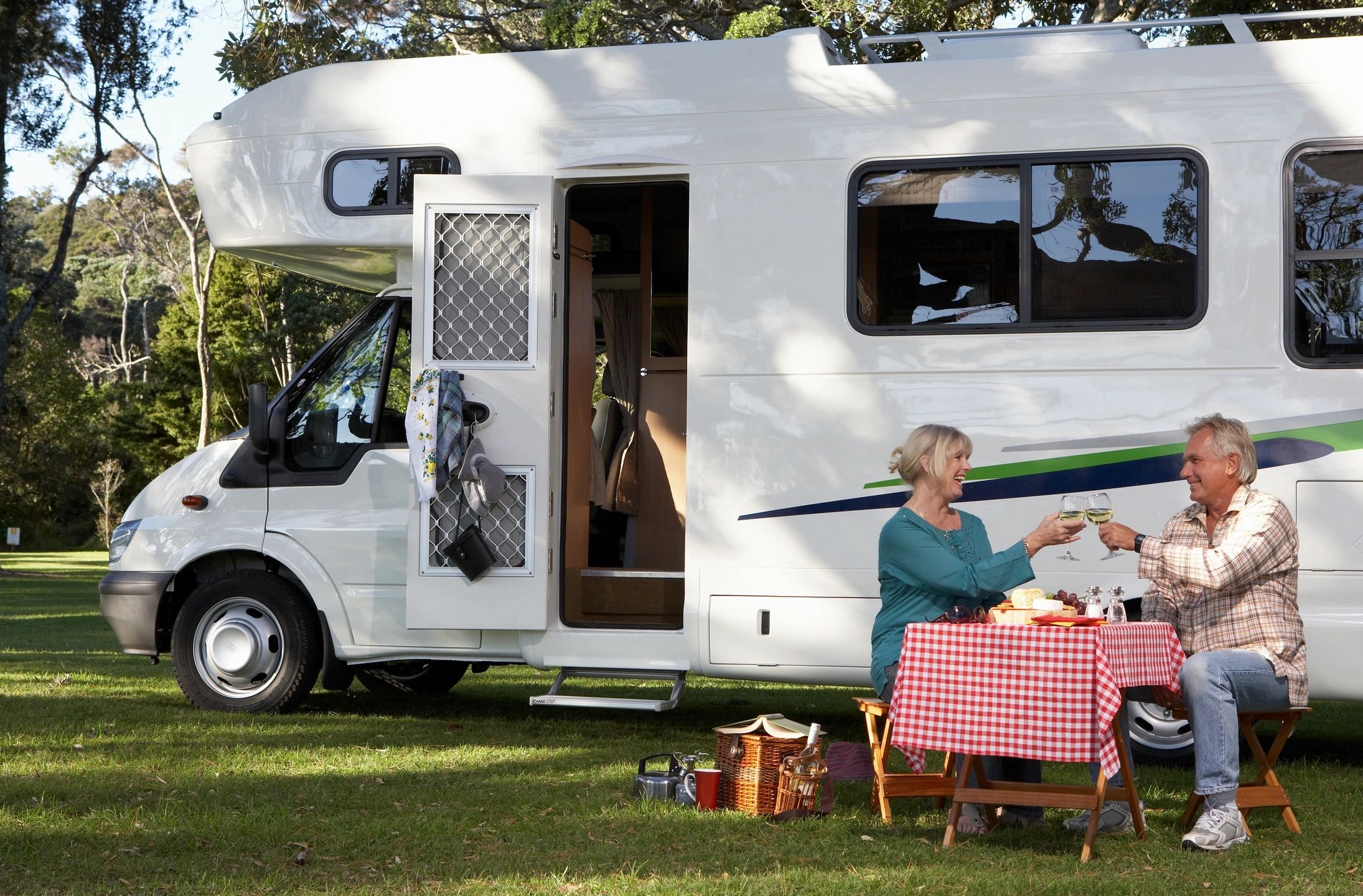 Picnic tables and fire rings at Lamplight RV Park campground